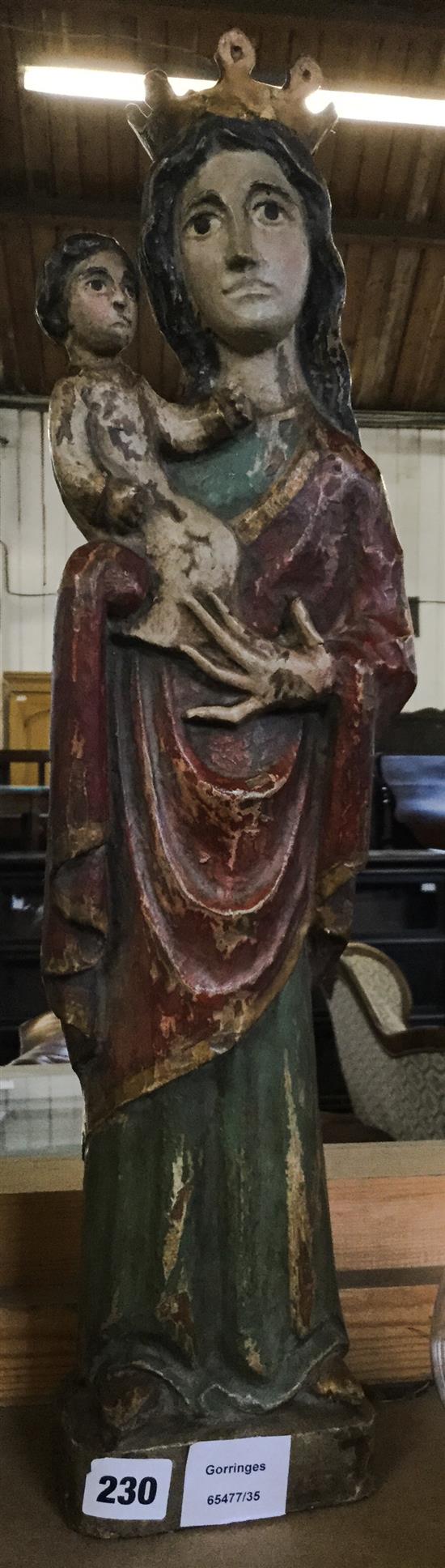 16th century style polychrome painted and carved wood model of the Virgin and child, a heraldic armorial & a carved wood putto (3)